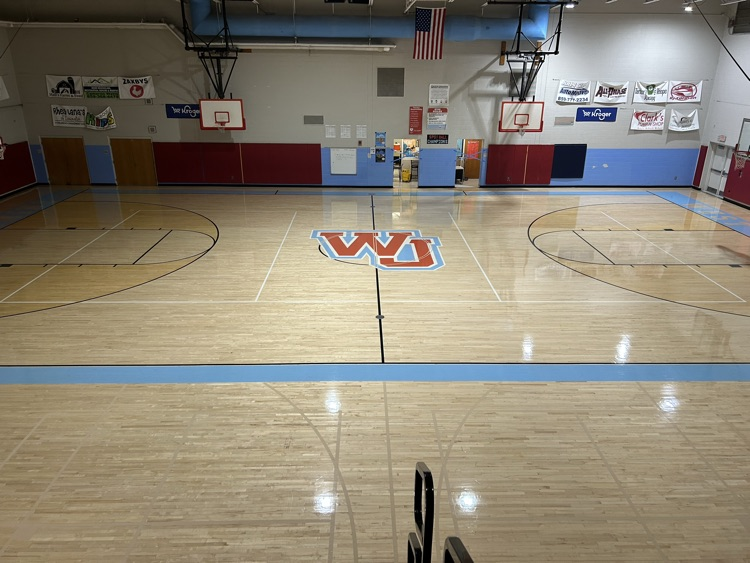 Jennifer and Michael work with David to make the gym shine at WM!