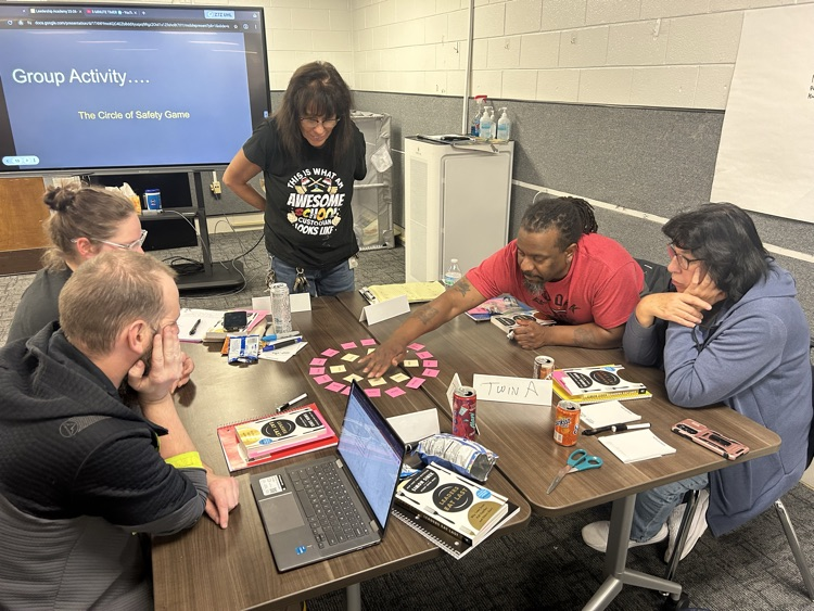 Custodians working together discussing leadership approaches