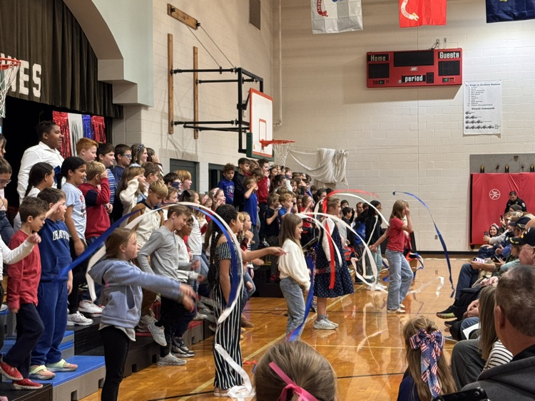 children, singing, and waving flags