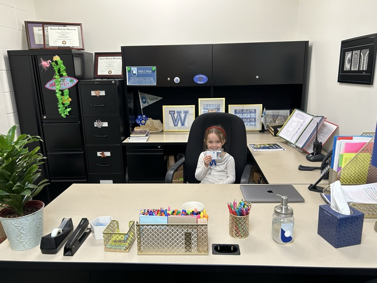 student at principal’s desk