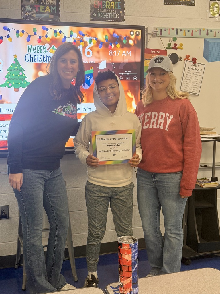 This picture includes the student winner, the classroom teacher and special education teacher.