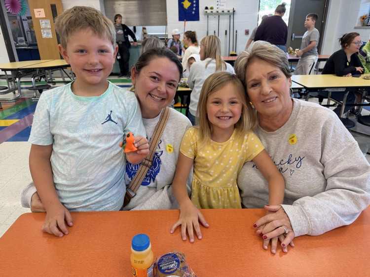 children with mom and grandma