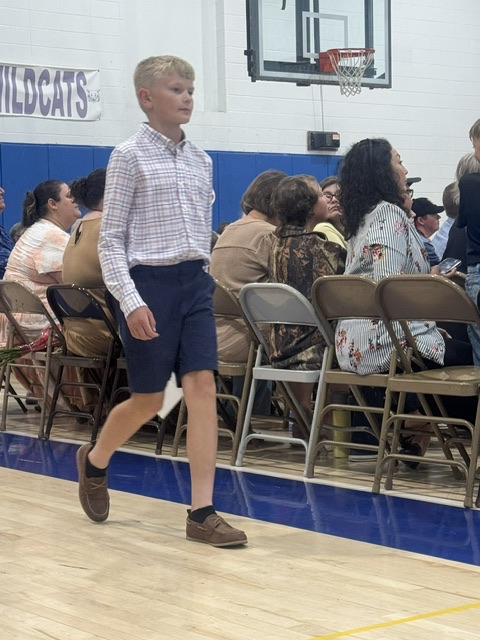 student walking to seat