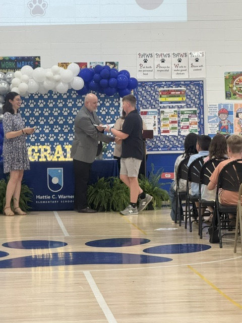student receiving certificate