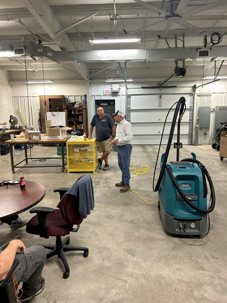 A representative from Baumann reviews the machine before we put it into action. 