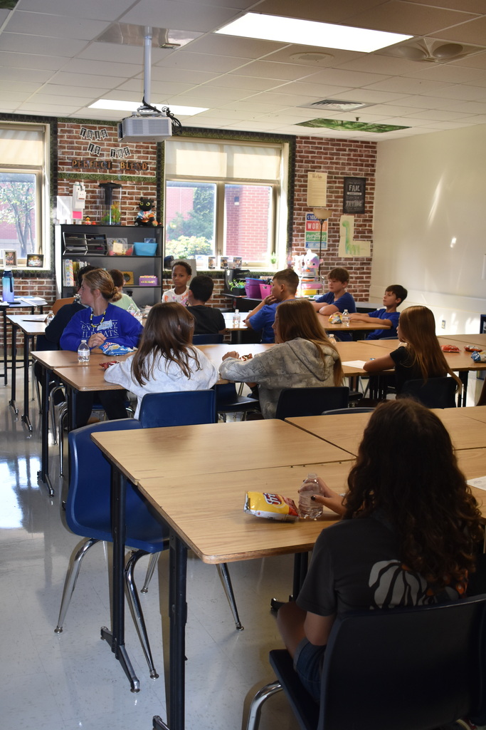 Sixth grade students learning about their middle school experience in Mrs. Rhodus' class.