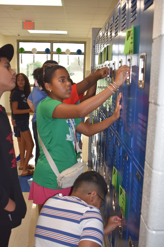 Sixth grade students practicing locker use.