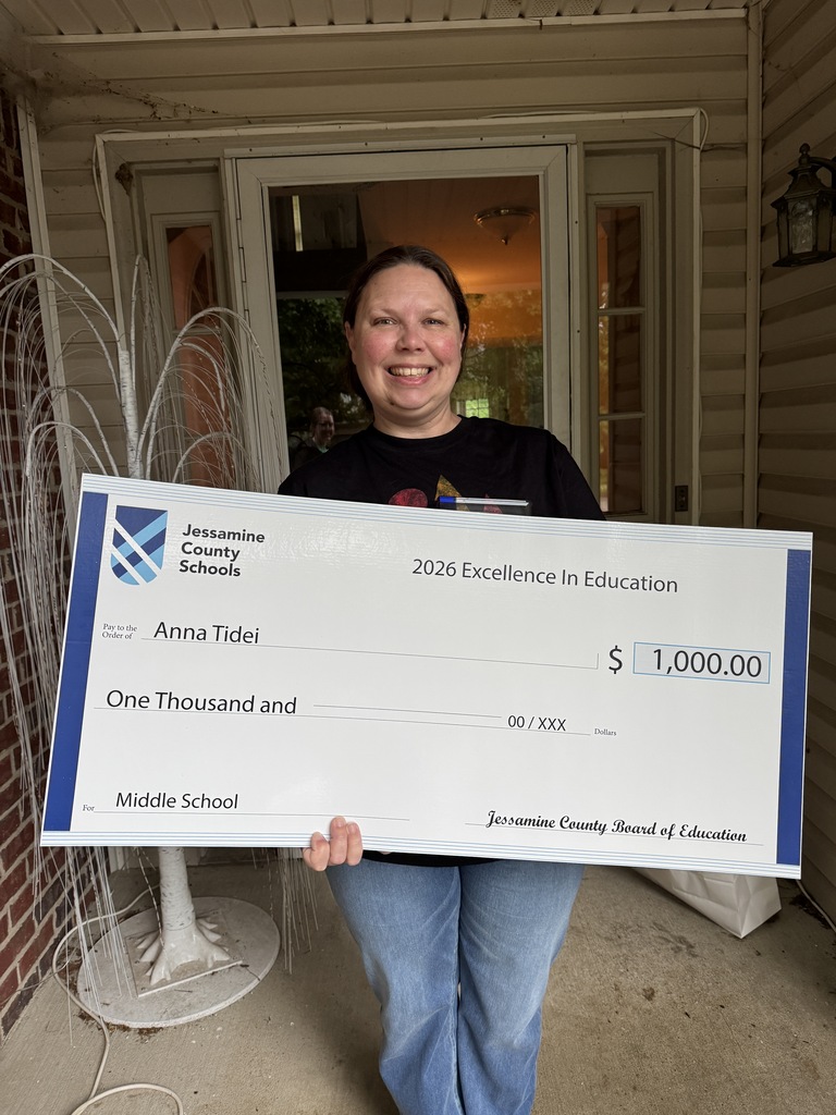 Jessamine County Schools Middle School Teacher of the Year winner, Mrs. Tidei accepting her $1,000 prize.