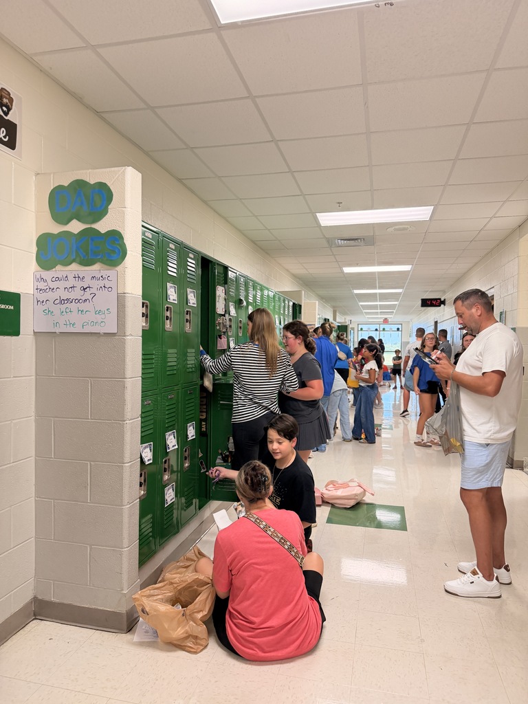 6th grade students and families setting up student lockers for the school year.
