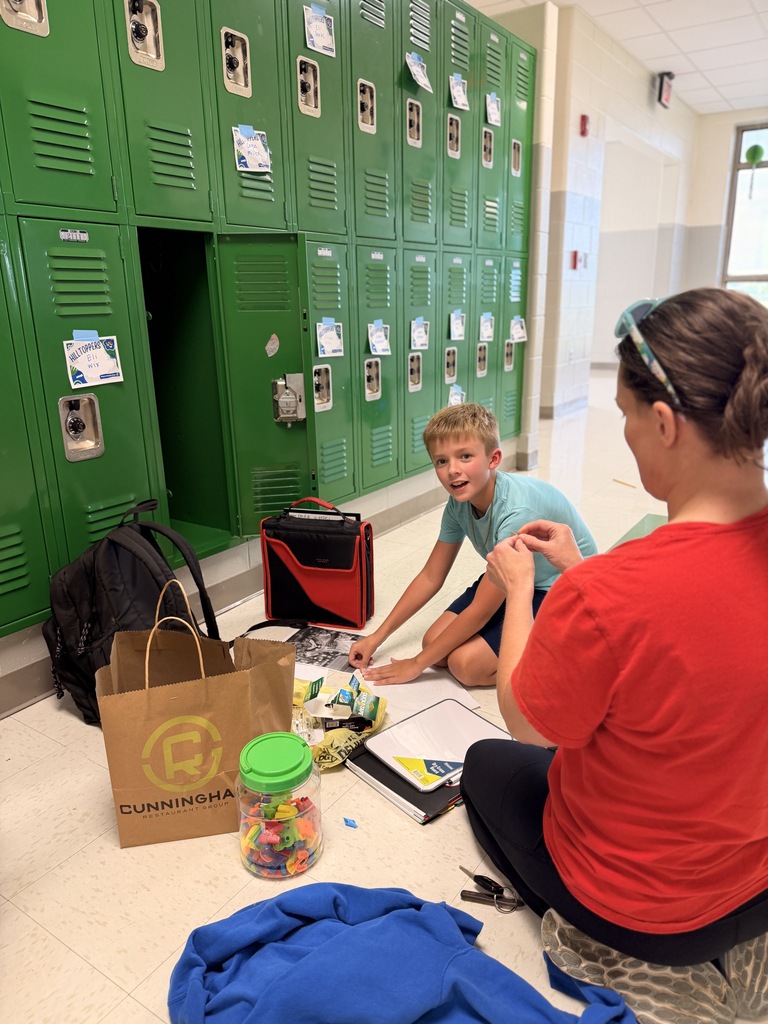 6th grade students and families setting up student lockers for the school year.