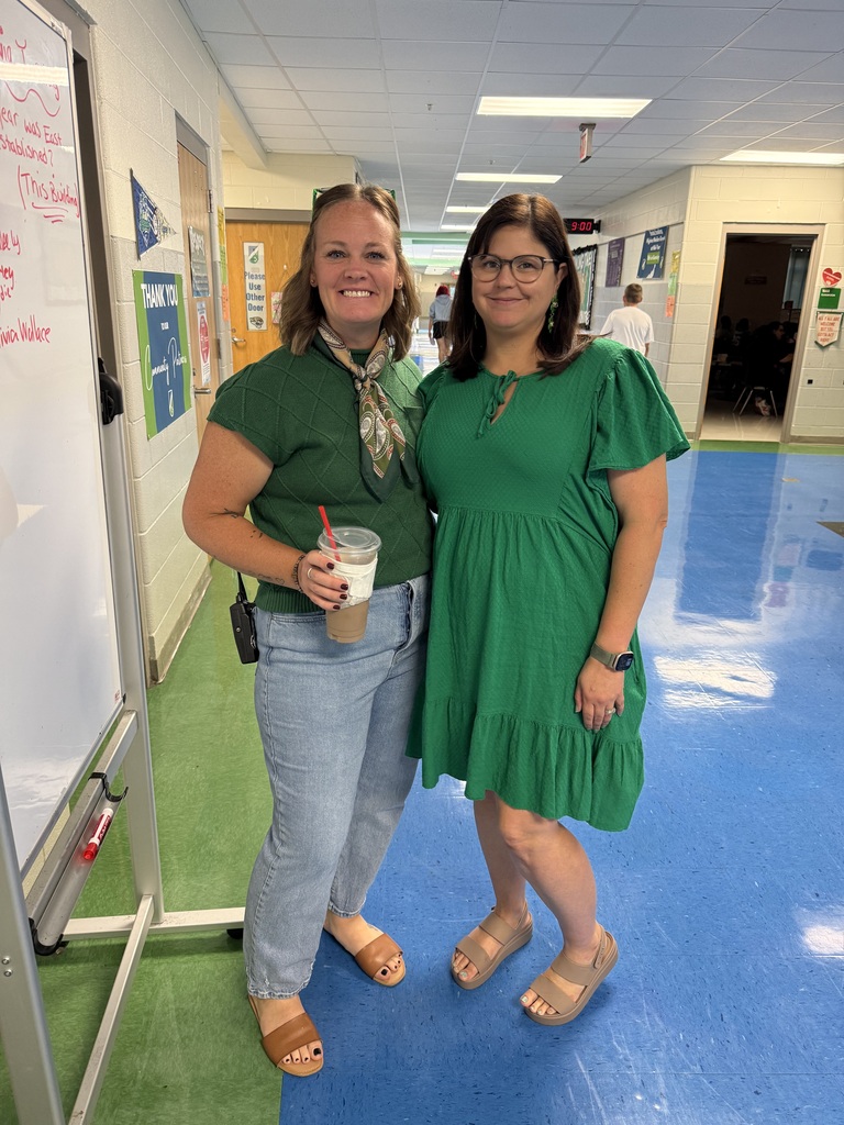 Mrs. Blackmore and Mrs. Crane wearing their best green for 6th grade!