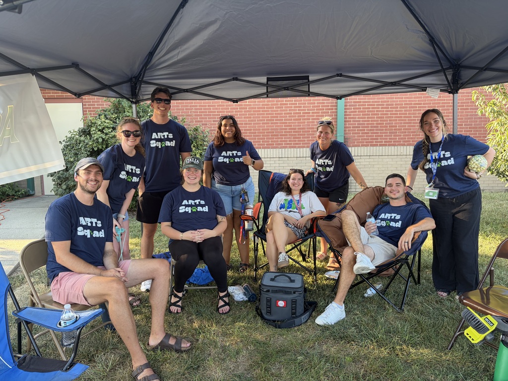 Our Arts Squad enjoying some shade and welcoming families with big smiles.