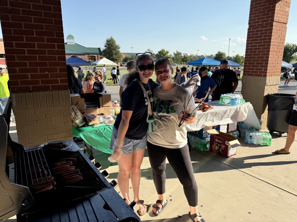 Mrs. G and Mrs. Blackmore keeping the people fed! No extra charge for tong clicks!