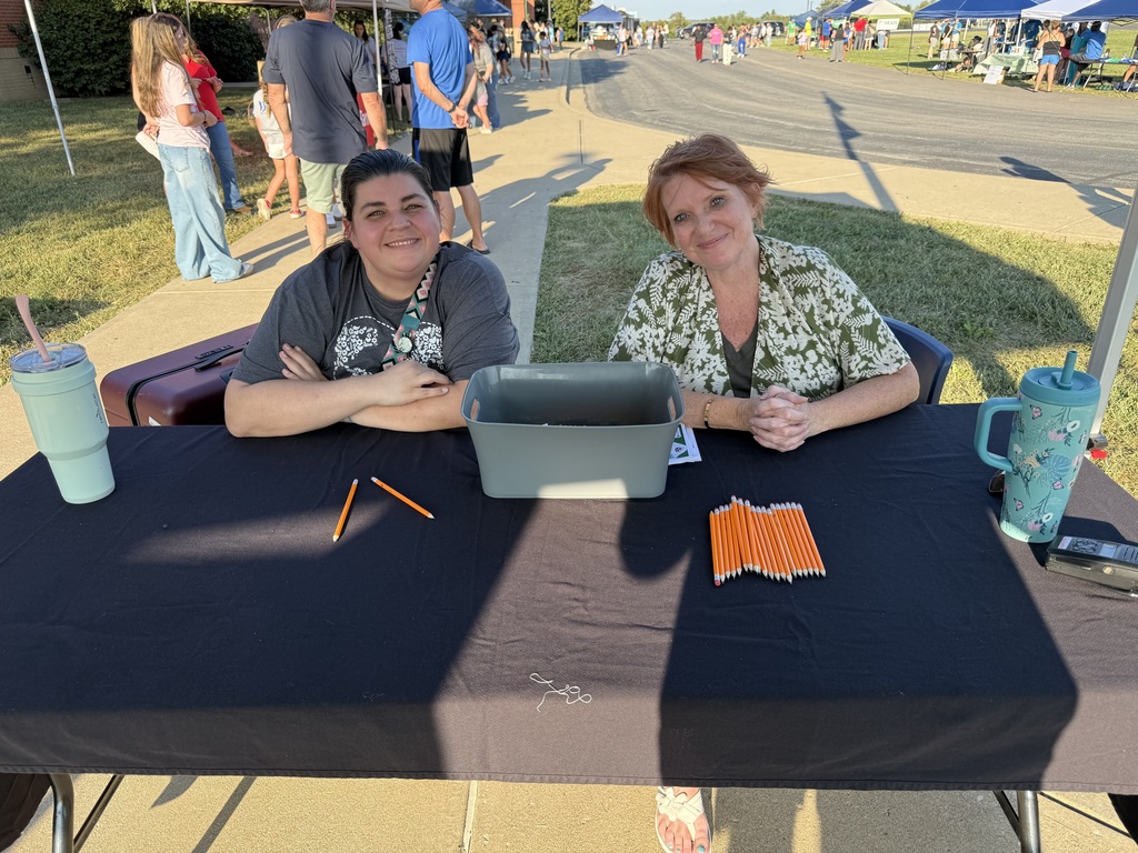 Ms. Lewis and Ms. Amburgey greeting families.