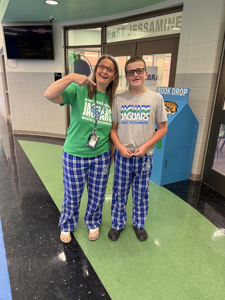 Mrs. Wallace and 7th grade, Ben, suited up in East pajamas.