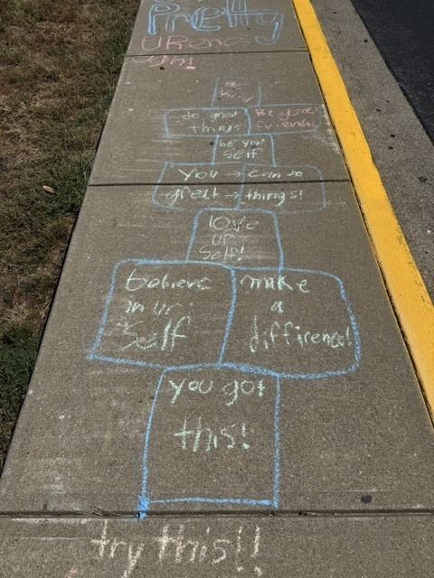 Messages of positive affirmation decorating the walkways of EJMS for 988 day.