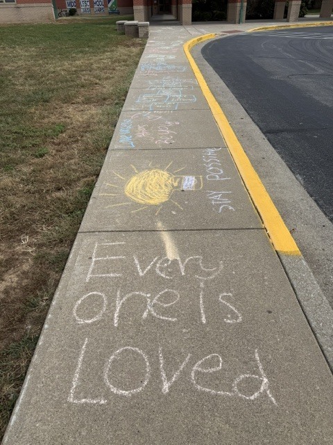 Messages of positive affirmation decorating the walkways of EJMS for 988 day.
