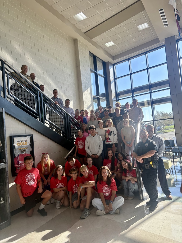 Sources of Strength Peer Leaders and community members kicking off Safe Schools Week, wearing red for mental health awareness.