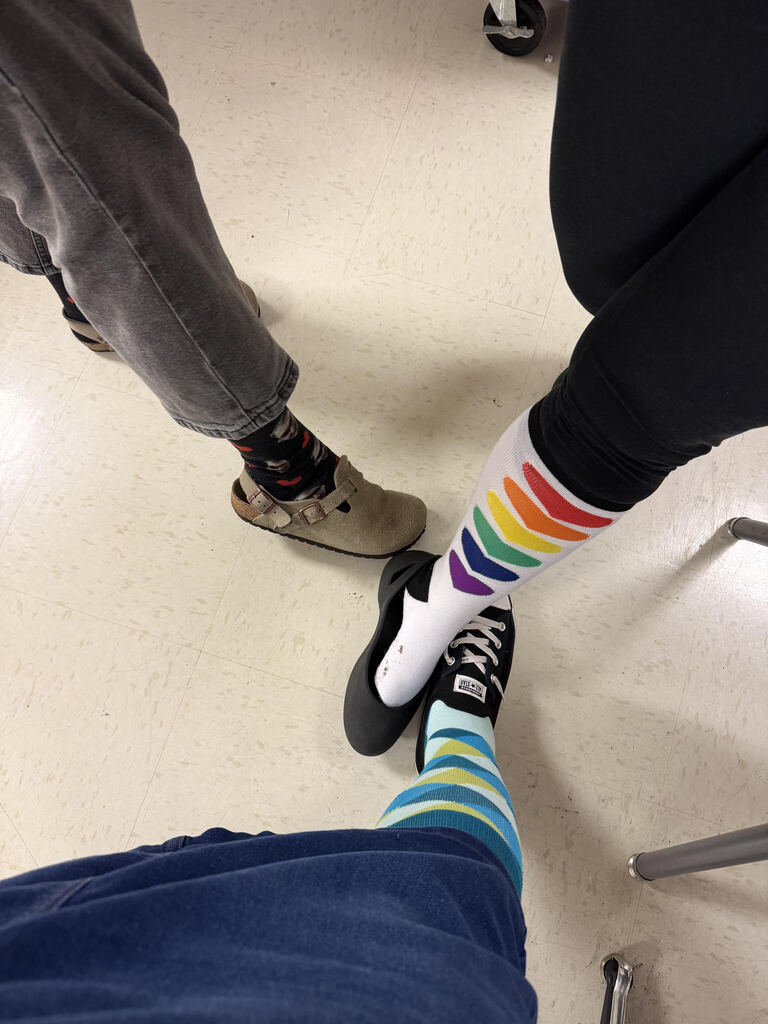 Mrs. Students and staff rocking unique socks for our wacky sock day, honoring Safe Schools Week.