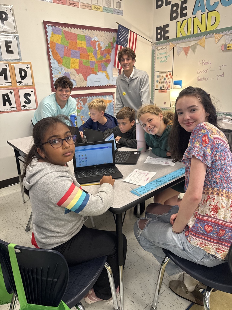 Students in the Entrepreneurship class (Business and Marketing pathway) working with 5th graders at Warner Elementary School on their Entrepreneurship Fair projects!