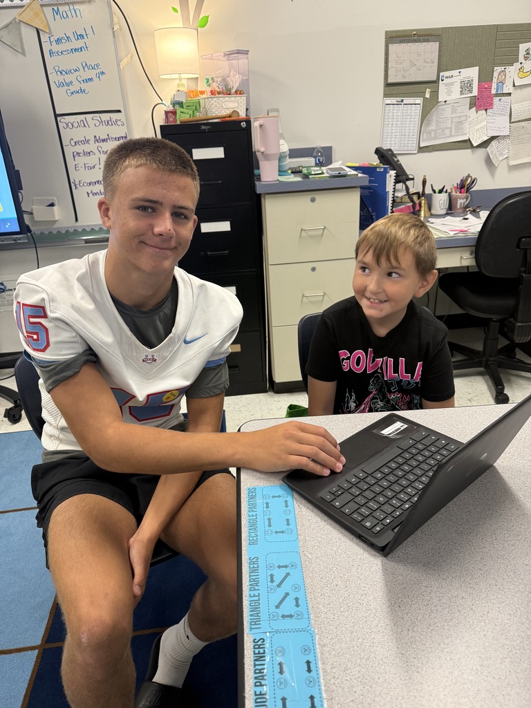 Students in the Entrepreneurship class (Business and Marketing pathway) working with 5th graders at Warner Elementary School on their Entrepreneurship Fair projects!