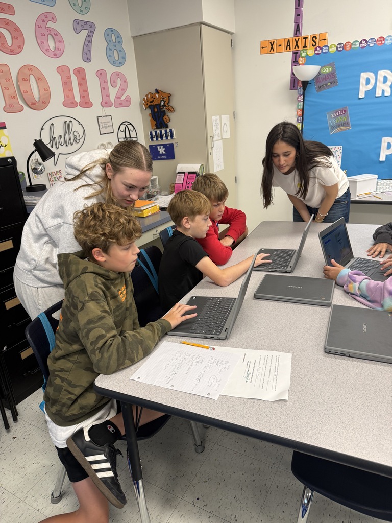 Students in the Entrepreneurship class (Business and Marketing pathway) working with 5th graders at Warner Elementary School on their Entrepreneurship Fair projects!