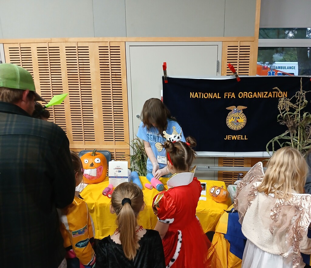 Student led FFA booth with elementary students 'trick-or-treating'