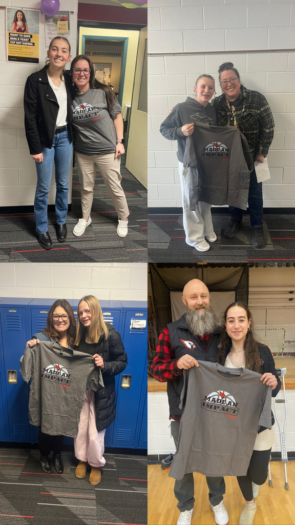 Students giving t-shirts to staff to show appreciation.
