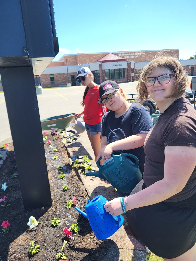 The J-L "Shoe Club" finished up the year with a community service event at the school. We weeded, planted flowers, and mulched around the sign and flag pole!