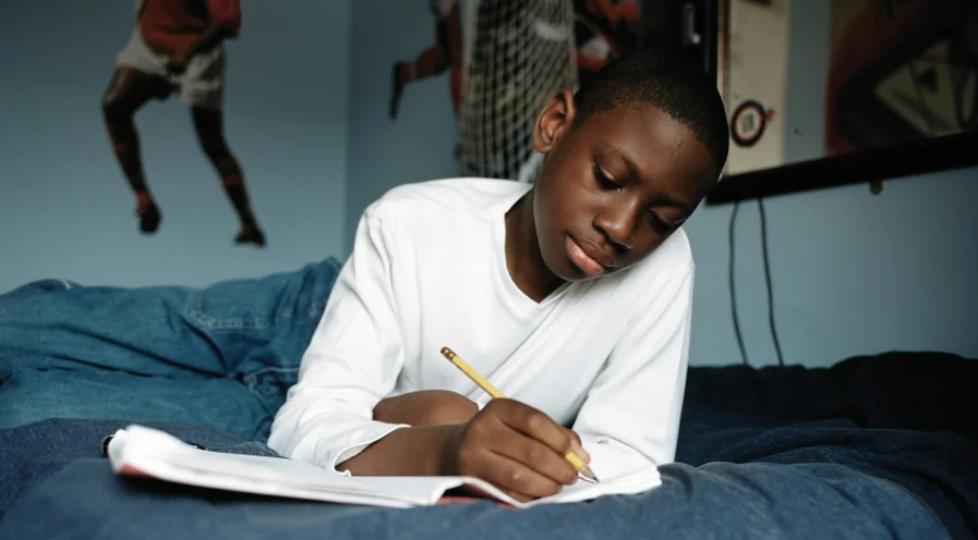Student taking notes by hand