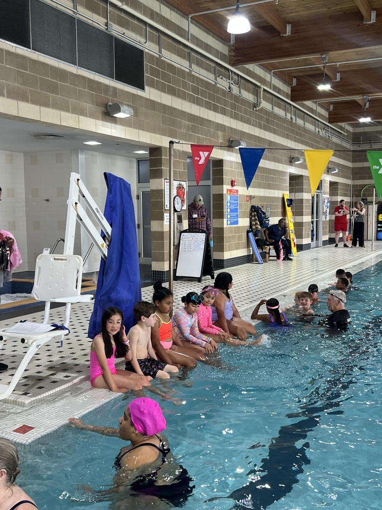 kids sitting on the pool edge