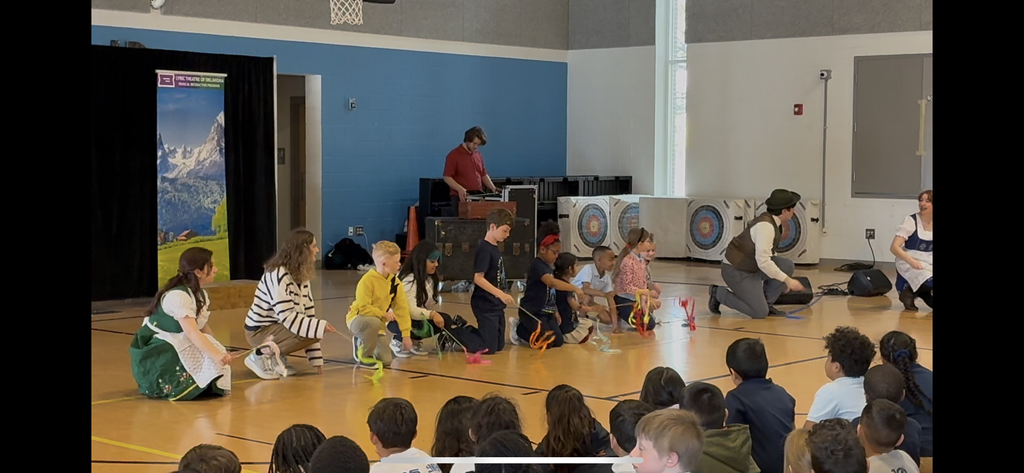 students acting in play