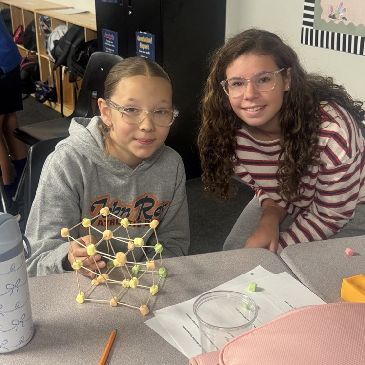 Students showing completed models