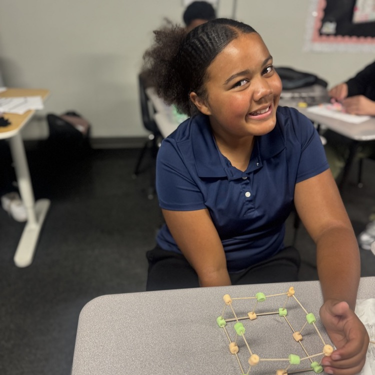 Student showing completed models