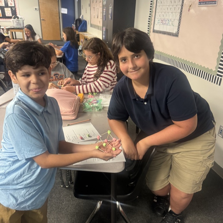 Students showing completed models