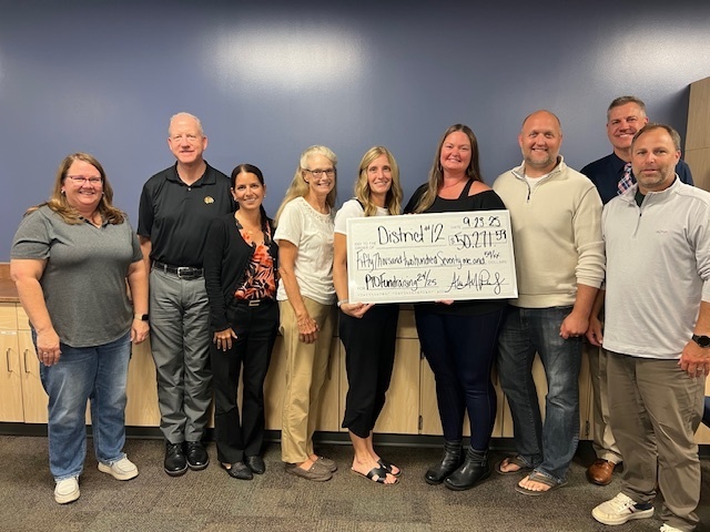 PTO and Board of Education with $50,000 check