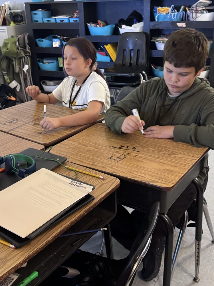 writing on the desks 