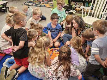 1st graders learn math with dominoes 