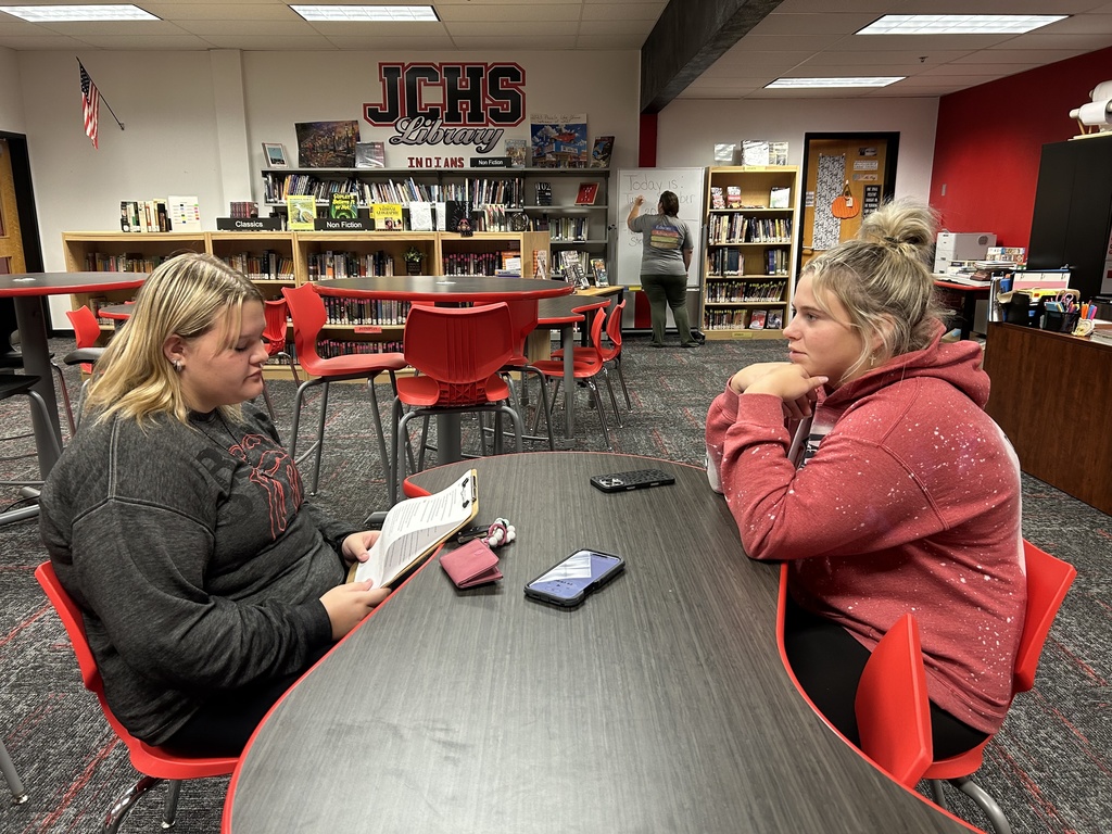Journalism student interviews student-athlete 