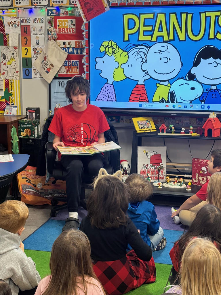 wms boys' basketball team reads christmas books to first-grade classes