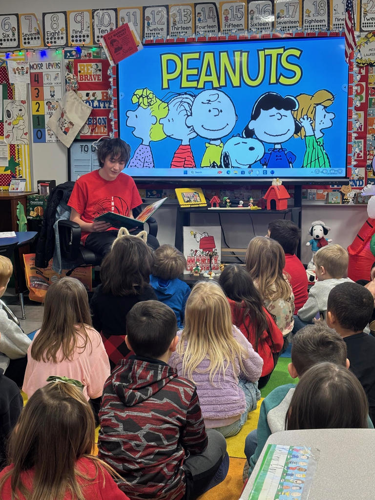 wms boys' basketball team reads christmas books to first-grade classes
