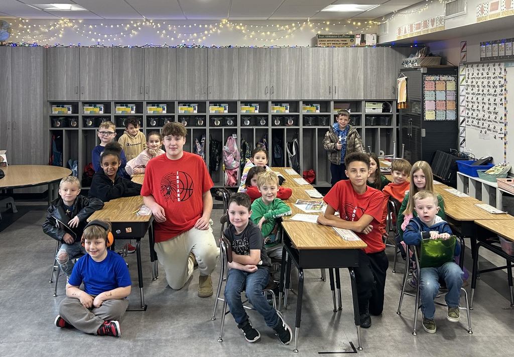 Washington Middle school boys' basketball team reads books to first-grade students