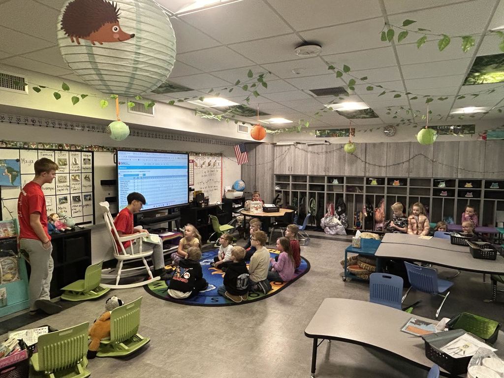 Washington Middle school boys' basketball team reads books to first-grade students