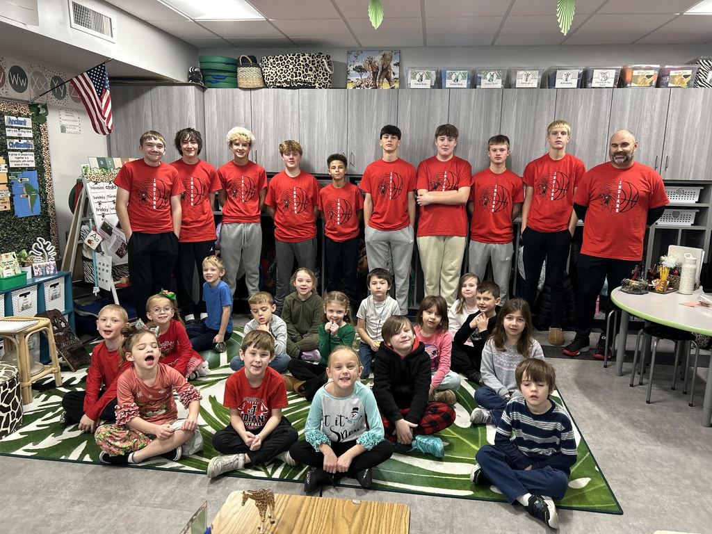 Washington Middle school boys' basketball team reads books to first-grade students