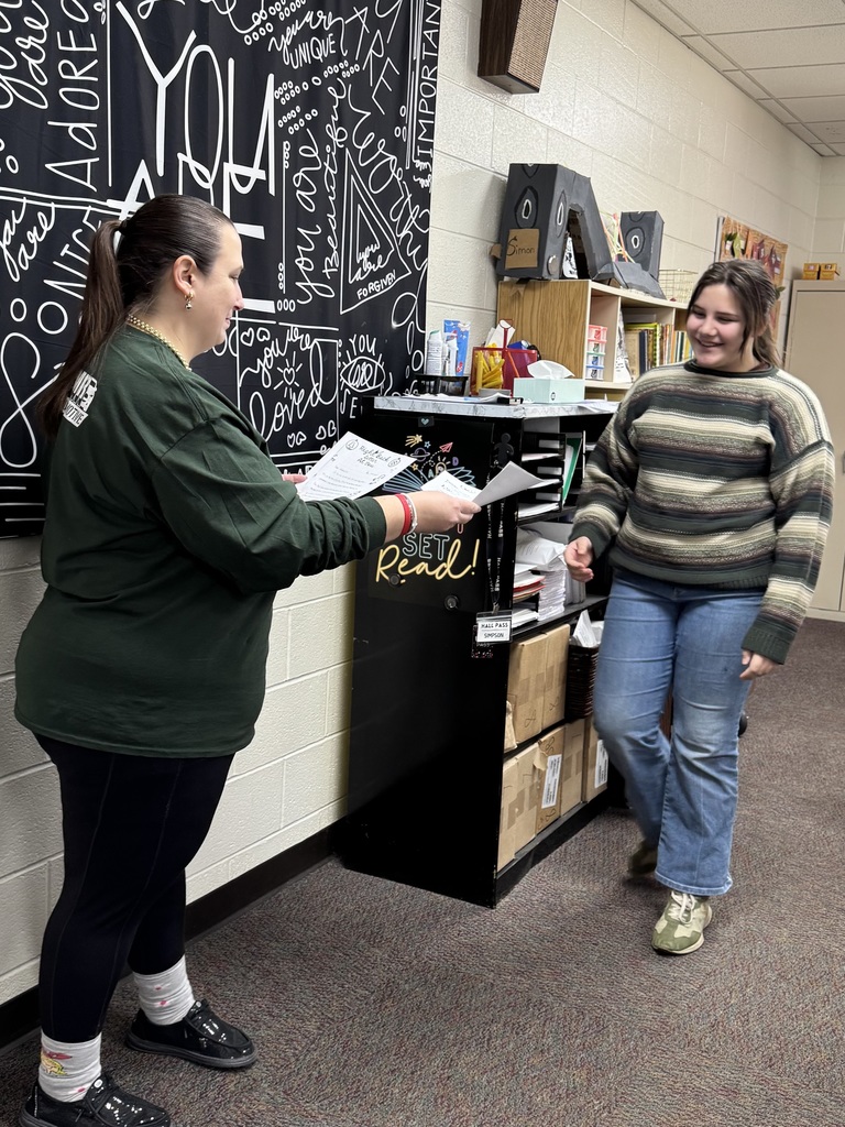 Seventh Grade students show off their pen pal letters