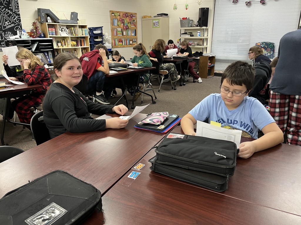 Seventh Grade students show off their pen pal letters