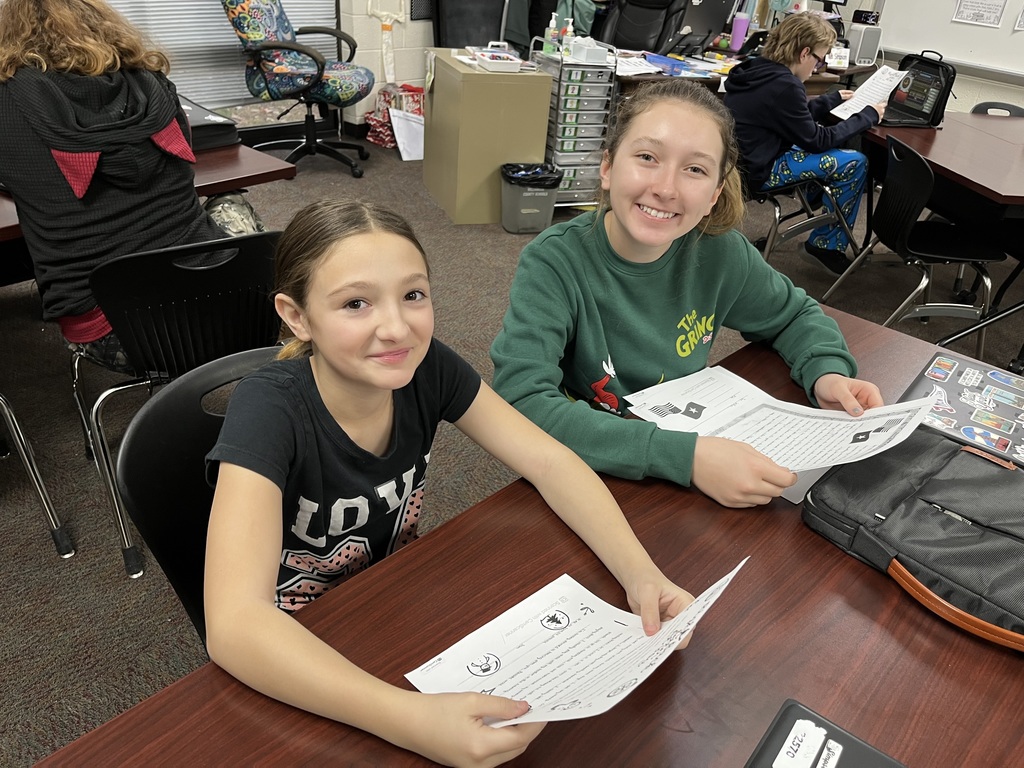 Seventh Grade students show off their pen pal letters