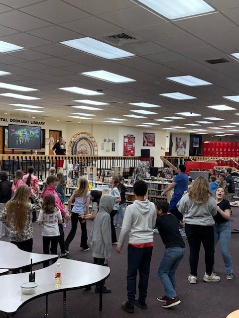 Students enjoy dancing in the library