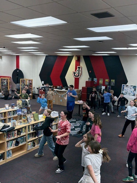 Students enjoy dancing in the library