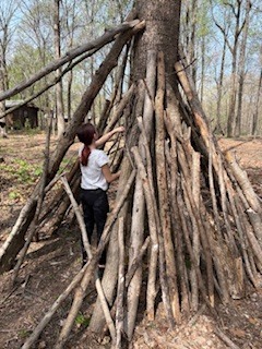 student working on her shelter
